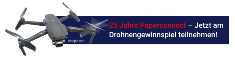 Ein dunkelblauer Balken auf dem steht: "25 Jahre Paperconnect – Jetzt am Drohnengewinnspiel teilnehmen! Link ist eine Beispielabbildung einer Drohne zu sehen, die fliegt.